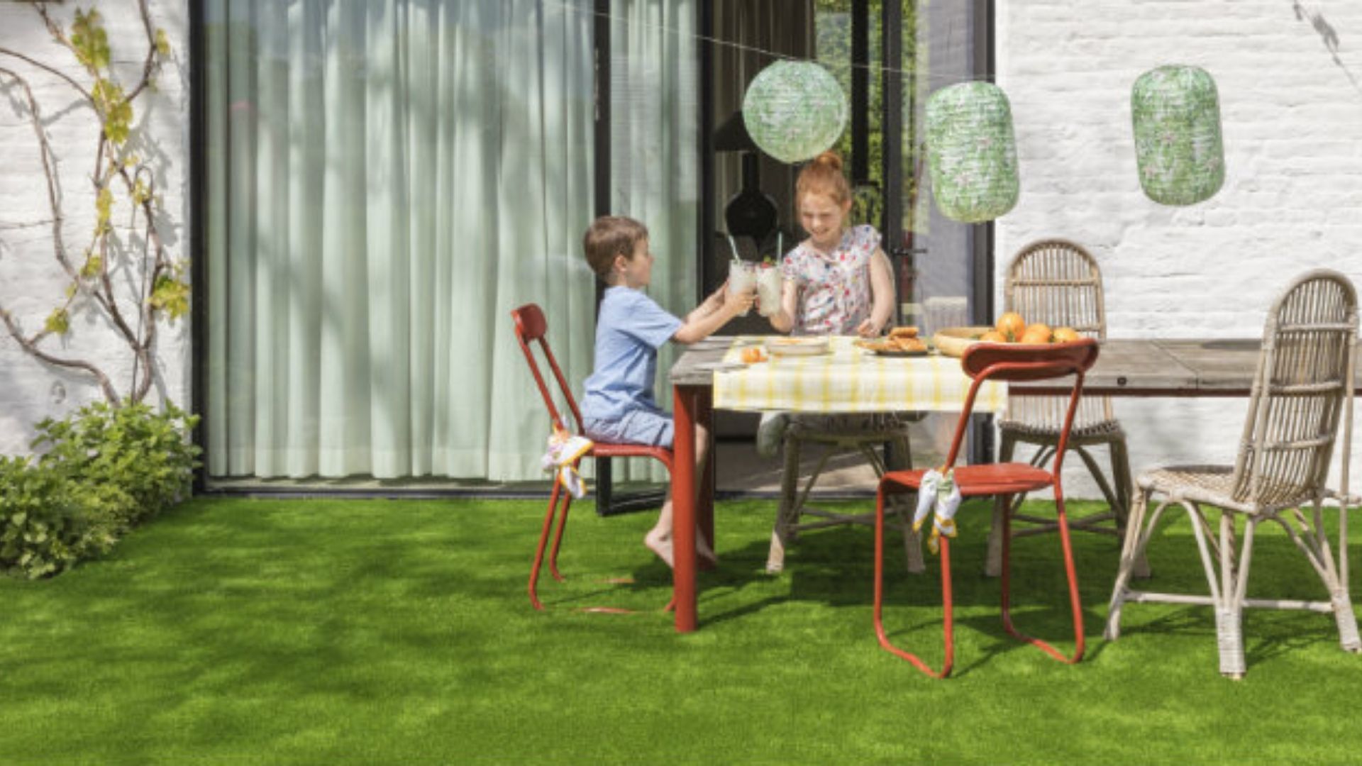 Family enjoying picnic on artificial grass 