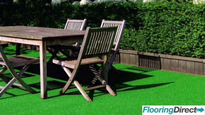 A garden table placed on top of artificial grass