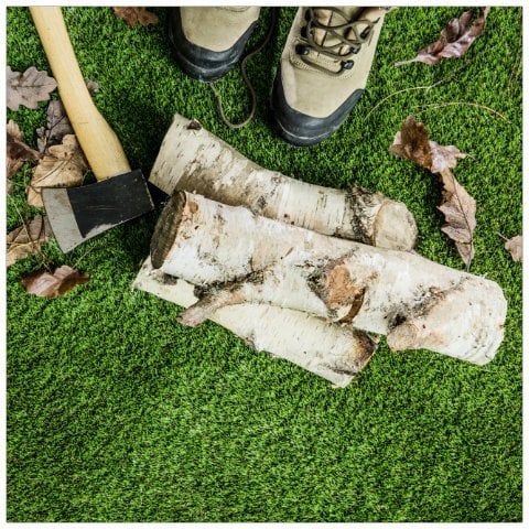 Chopping wood on artificial grass